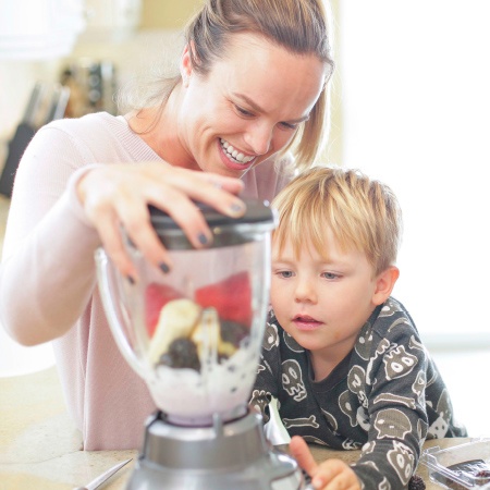 mom and son making a smoothie